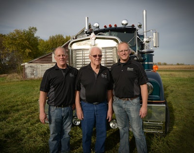 Joel, John and Jay TeBrake with John’s prized 1965 Kenworth. It’s been in the family since well before John founded Truck Transport with another owner-operator in 1987. Before and since John passed early this year, Jay and Joel maintain the KW as a showpiece, often participating in the Big Iron Classic in their native Minnesota, among other shows.