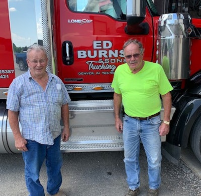 Terry Burns, right, is general manager of Ed Burns & Sons Trucking, founded by his father, Ed Burns. Terry’s pictured here with his brother, Mike, and one of the company’s International tractors.