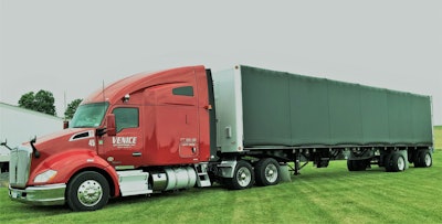 Among the Venice trailers of varying types is this curtainside flatbed.