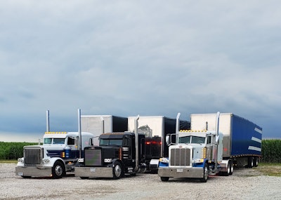 Warren Hartman Trucking has come a long way since its beginnings in 2011, when Hartman had $20,000 in the bank and had bought an old Werner truck, a Kenworth T600. He maintained it himself before paying it off and “making a lot of money” with it. With the recent expansion, the business has posted annual net income well into the six figures these past couple of years. His debt load is relatively small considering the large equipment investments made recently. Pictured here are the three company-owned trucks (left to right): the rig driven by his longest tenured driver, a 2018 389; Hartman’s daily driver, a 2001 Peterbilt 379; and the first truck he ever spec’d out and bought new, a 2014 389.