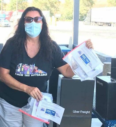 Independent owner-operator Desiree Wood and her Real Women in Trucking group were central to shipping and distributing the care packages. In addition to the 10,000 boxes from Uber Freight, Wood and RWIT supplemented those gifts with additional packs of face masks, pictured here.