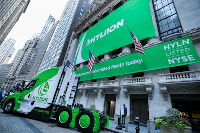 Hybrid-electric truck at NYSE | The New York Stock Exchange welcomed Hyliion, Inc., today as executives rang in the bell in celebration of its initial public offering. The event follows last week’s announcement that the company had completed its business combination with Tortoise Acquisition Corp. The business combination, approved by Tortoise stockholders on Sept. 28, 2020, results in the combined company being renamed “Hyliion Holdings Corp.,” with its common stock being listed on the NYSE under the ticker symbol “HYLN” and its warrants listed under the ticker symbol “HYLN WS.” Hyliion’s hybrid and “hypertruck ERX” electric powertrain solutions are intended to reduce greenhouse gas (GHG) emissions and total cost of ownership; the company continues to develop and commercialize the offering. Photo: NYSE