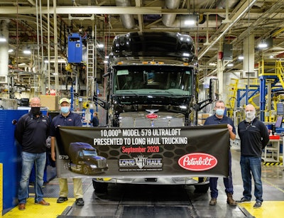 10,000th Pete 579 Ultraloft delivered | Peterbilt’s 10,000th production Model 579 UltraLoft has been delivered to Long Haul Trucking of Albertville, Minn. “To receive the 10,000th Model 579 UltraLoft is a great honor for us at Long Haul Trucking,” said Fleet Operations VP Josh Hainstock. The fleet addition came on top of 140 579s already operating in the company. The UltraLoft 579 is distinguished by ample interior storage capacity — 70 cubic feet all told, featuring multiple compartments, a wardrobe closet and several cubbies. A fold-away ladder provides easy access to the upper bunk and disappears when not in use. The integrated sleeper provides a 200-lb. weight savings and up to a 2% aerodynamic enhancement over Peterbilt’s discrete sleepers, the company says, equating up to a 1% fuel efficiency improvement to the bottom line.