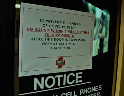 COVID-19 notice on white's travel center door