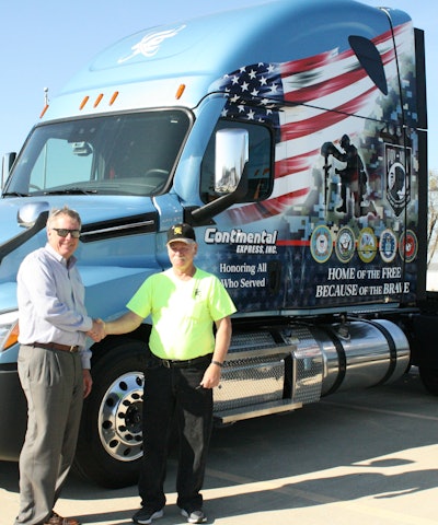 Continental Express President Russ Gottemoeller (left) presents the keys to the company’s new veterans-themed truck to driver Rick Brown. Brown has driven for Continental since 2013 and is a veteran of the U.S. Air Force.