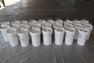 Buckets filled with alleged liquid meth drained from a truck’s fuel tanks. (CBP photo)