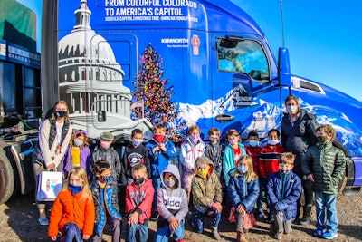 A group of children visited the tree along its journey in Gunnison, Colorado, on Nov. 12. (Photo by James Edward Mills)