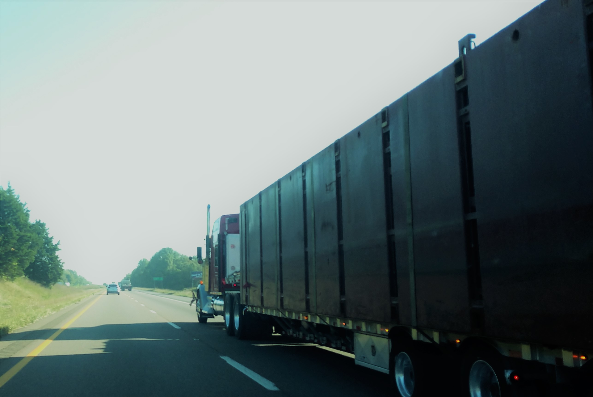 Curtainside flatbed truck on the highway