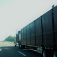 Curtainside flatbed truck on the highway