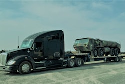 Lance Buttermore's 2015 Kenworth t680 hauling military machinery