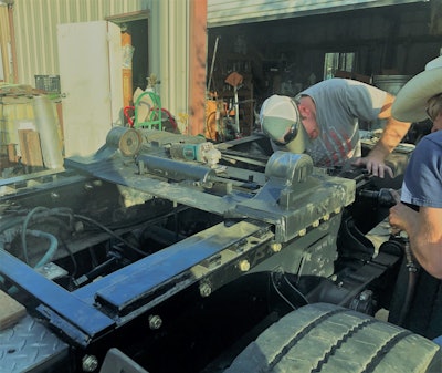 Zach Beadle putting new frame on truck