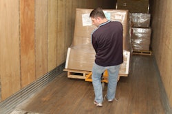 Operator unloading a dry van trailer