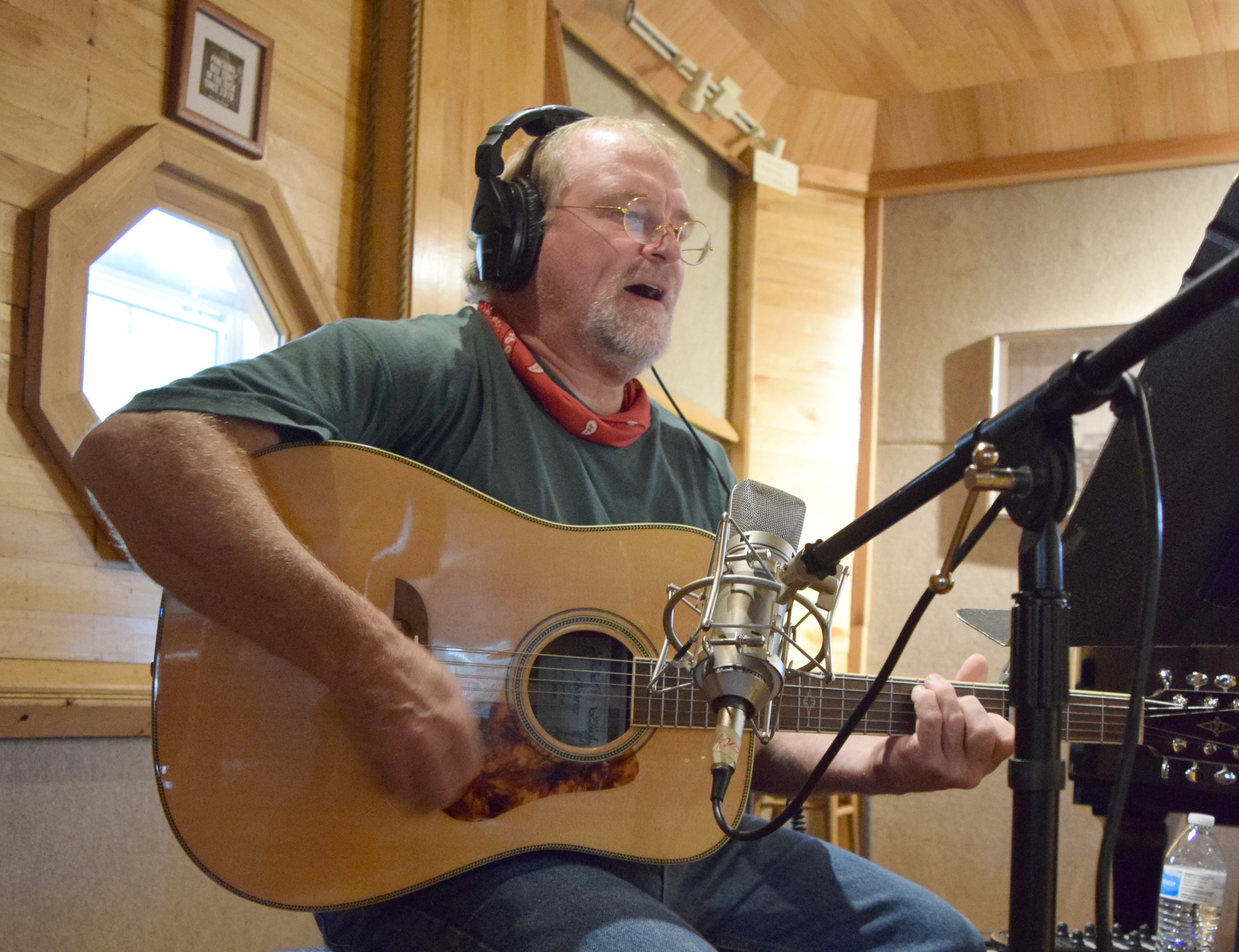 2020 Trucker Talent winner John Malayter playing guitar and singing in studio
