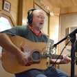 2020 Trucker Talent winner John Malayter playing guitar and singing in studio