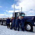 Dustbusters owner Craig Prete standing next to Austin Oliver, Kipp Knight, Cole Potter, and Martin Herman in front of Prete's 1980 Kenworth W900A
