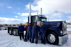 Dustbusters owner Craig Prete standing next to Austin Oliver, Kipp Knight, Cole Potter, and Martin Herman in front of Prete's 1980 Kenworth W900A