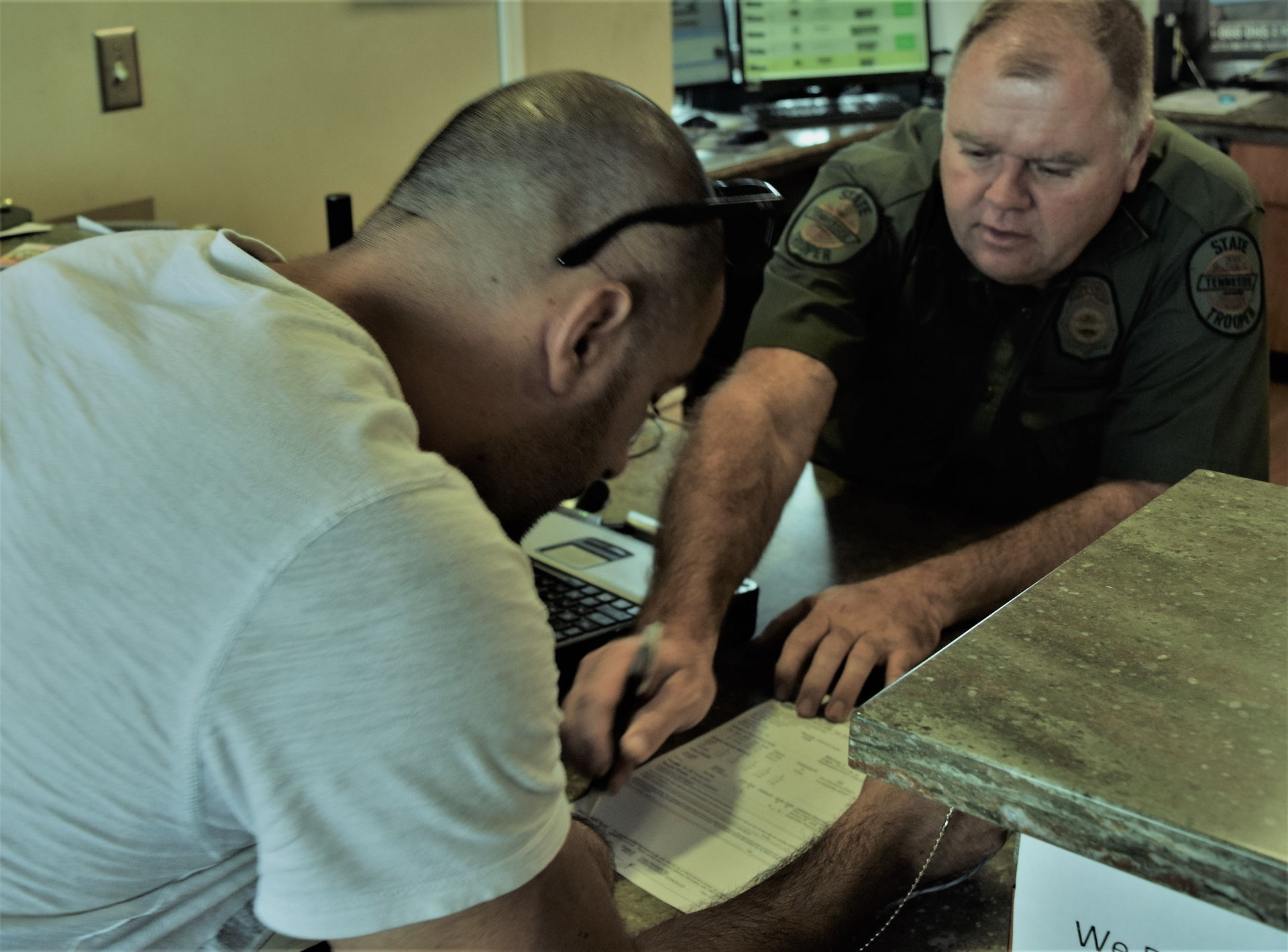 Two men going over paperwork