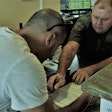 Two men going over paperwork