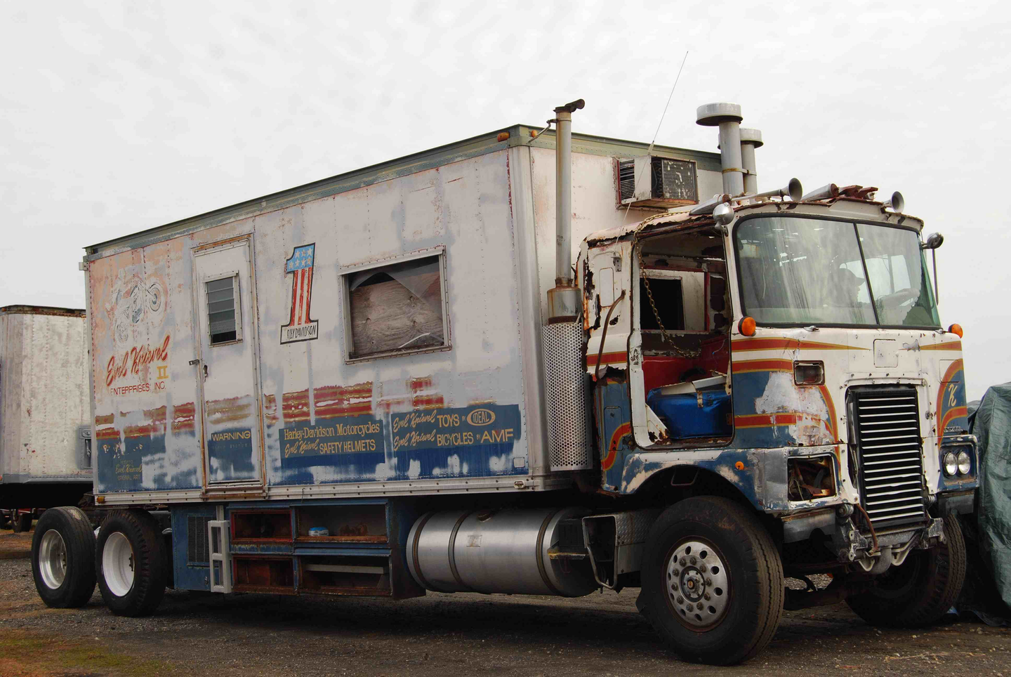 In 2012, the truck and trailer was moved to Wike's shop in North Carolina for some initial work Wike described in the video below. The steering had been locked up, the fuel tank dry and full of dirt. Wike managed to get the Cummins engine started after plenty of clean-up and trial and error, and plans for the rig at the time were for a cab replacement via Elizabeth Truck Center in New Jersey, where a replacement cab had been located. The ultimate goal in the restoration, too, was to restore the painting to Knievel's original red-dominated scheme, in place before Knievel apparently reversed the red and blue of the original paint colors when he went on his European tour late in his career.
