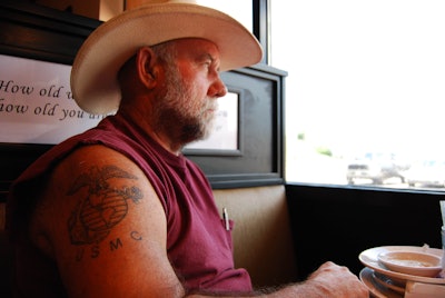 Mike Crawford sitting in a truck stop booth