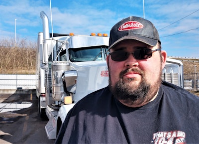 Scott Reed standing in front of his 2019 Kenworth