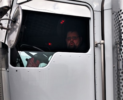 Scott Reed behind the wheel of his Kenworth