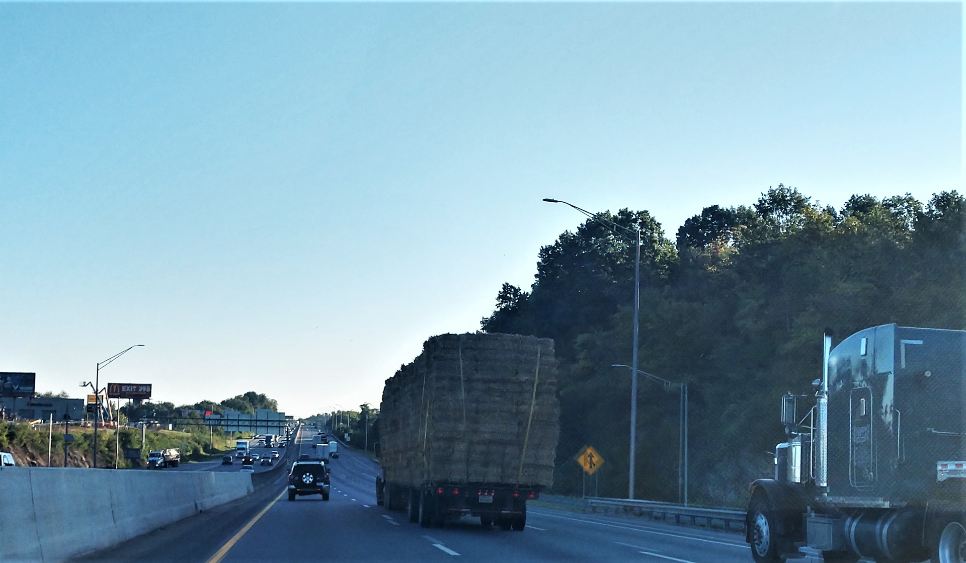 Semi trucks and cars on highway