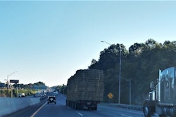 Semi trucks and cars on highway