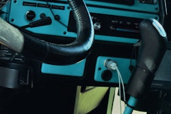 Inside truck view of steering wheel and front dashboard