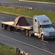 WTI flatbed truck on highway