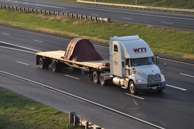 WTI flatbed truck on highway