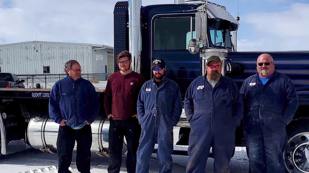 team photo taken outside of 1980 Kenworth W900A