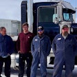 team photo taken outside of 1980 Kenworth W900A