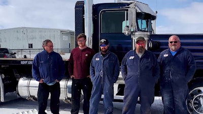 team photo taken outside of 1980 Kenworth W900A