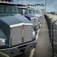 semi trucks parked in a row