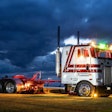 Peterbilt truck with lights glowing during dusk