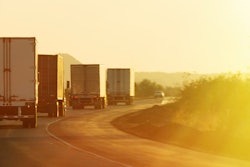 Semi trucks driving along highway