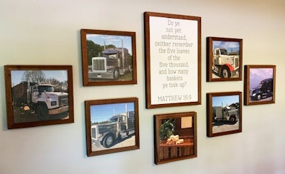 8 trucking history pictures hanging on a wall