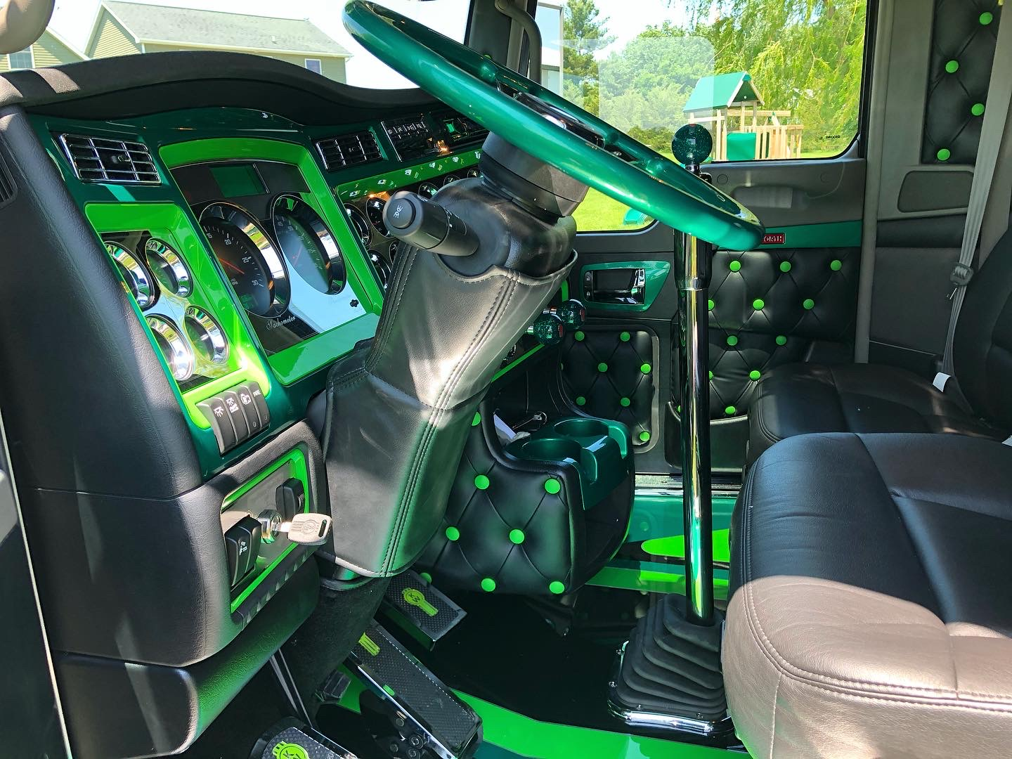 Inside view of truck decked out with green accented interior