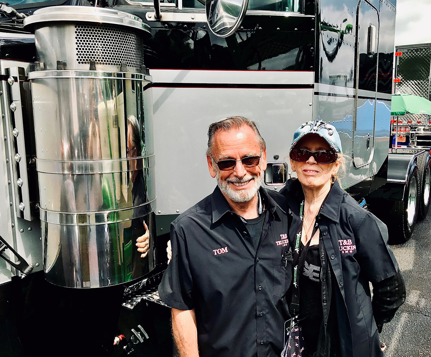 Tom and sunny billington outside of their custom peterbilt truck