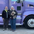 Phil and Annett Albert standing in front of their semi-truck