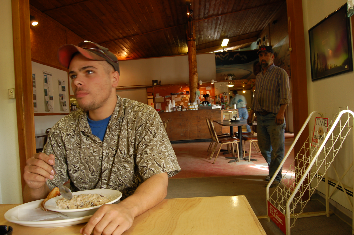 Man eating inside restaurant