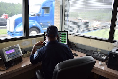 Inspection Officer Screening Trucks Scale