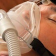 man with sleep apnea mask on