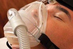man with sleep apnea mask on