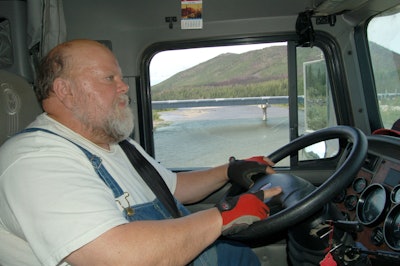 Trucker driving alongside river
