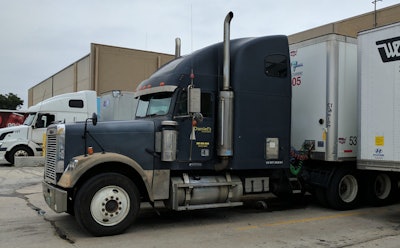 semi truck docked in loading area