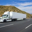 penske truck driving on roadway