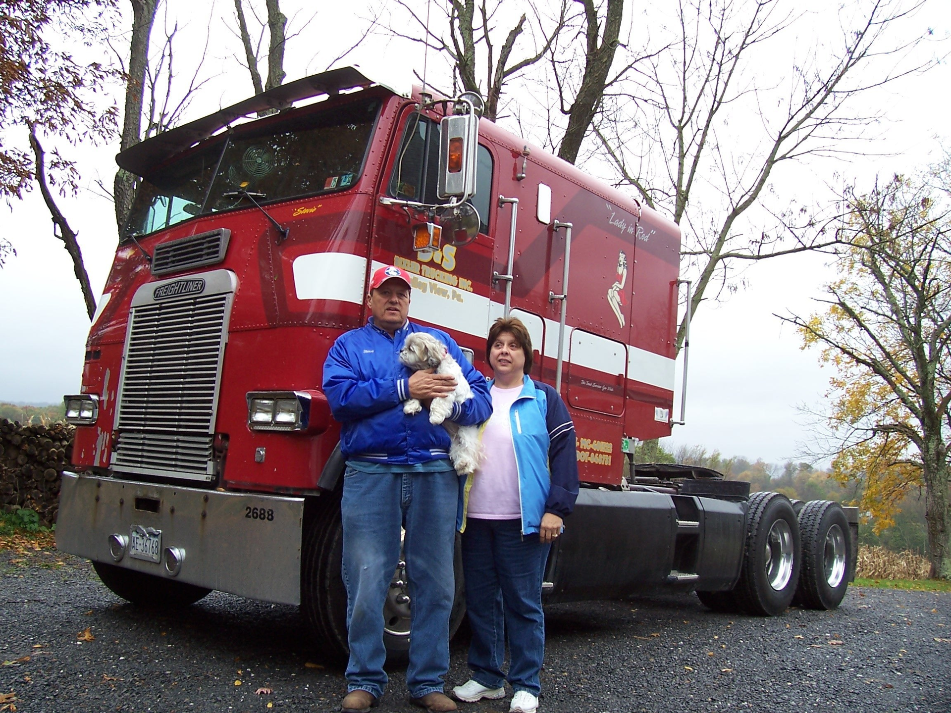 Steve and Doris Bixler having picture taken outside of truck