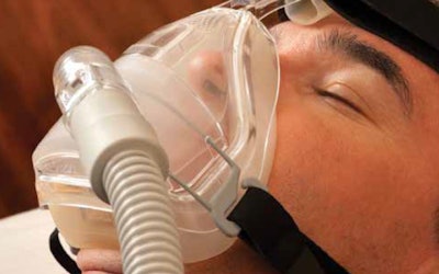 man with sleep apnea mask on